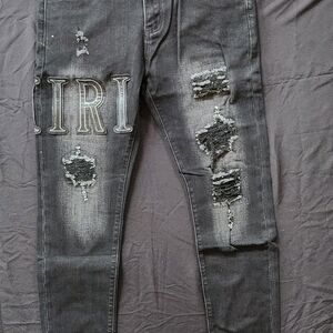 AMIRI Distressed Black Skinny Jeans